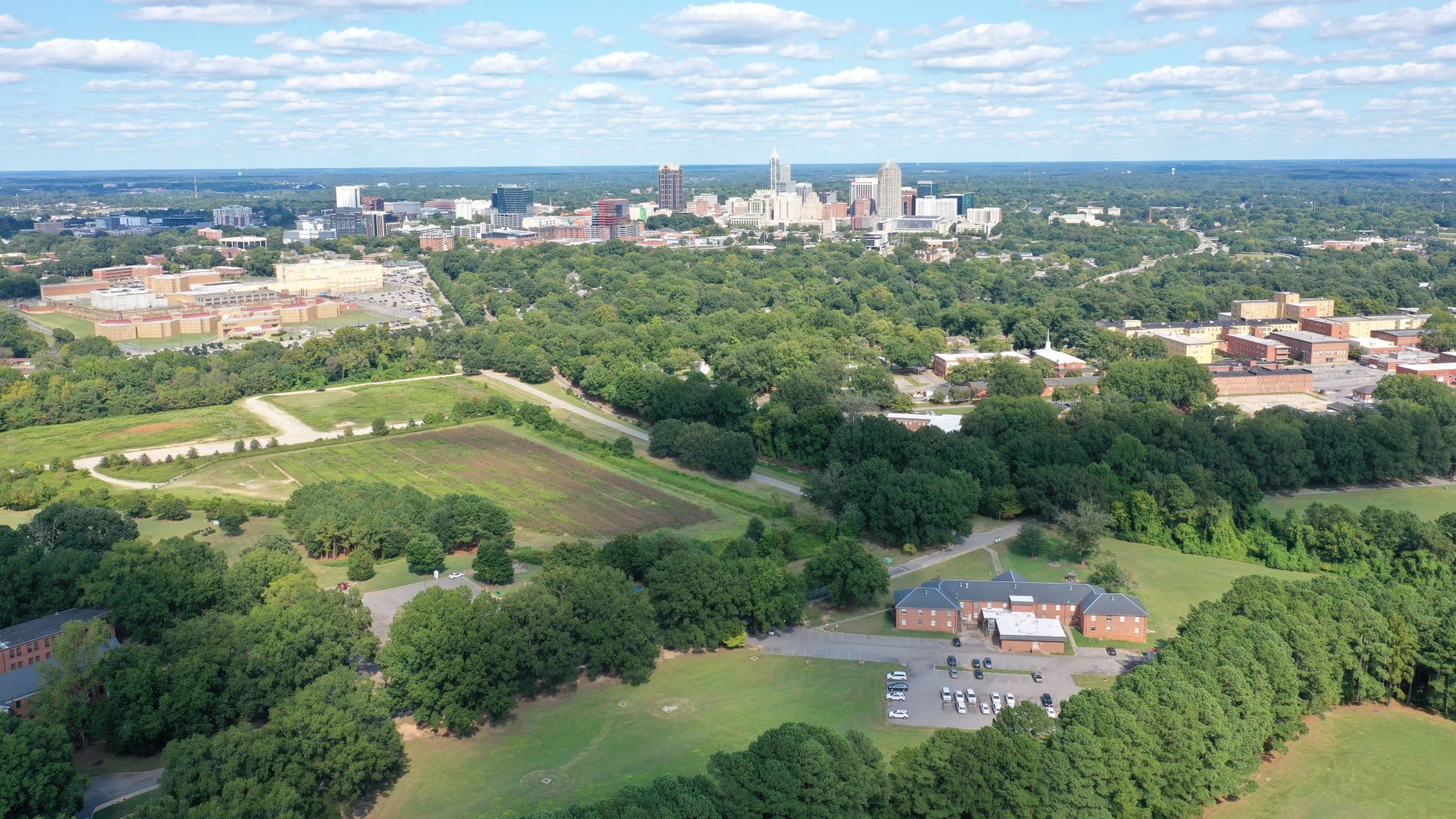 Drone shot of Dix Park looing towards downtown Raleigh