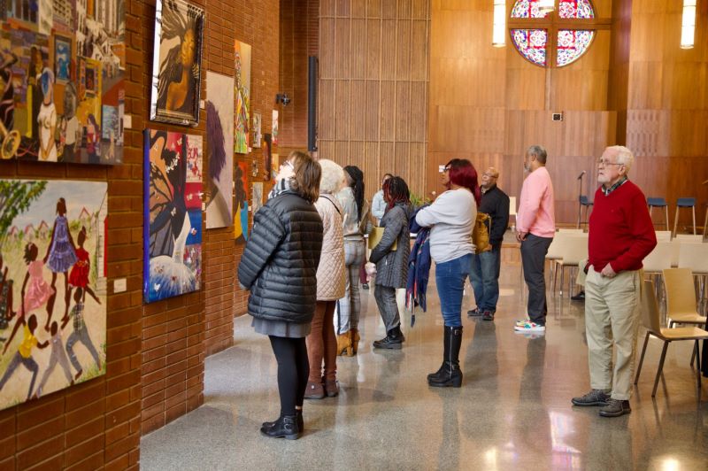People looking at art at the Chapel during the Living in Color Opening 2023 