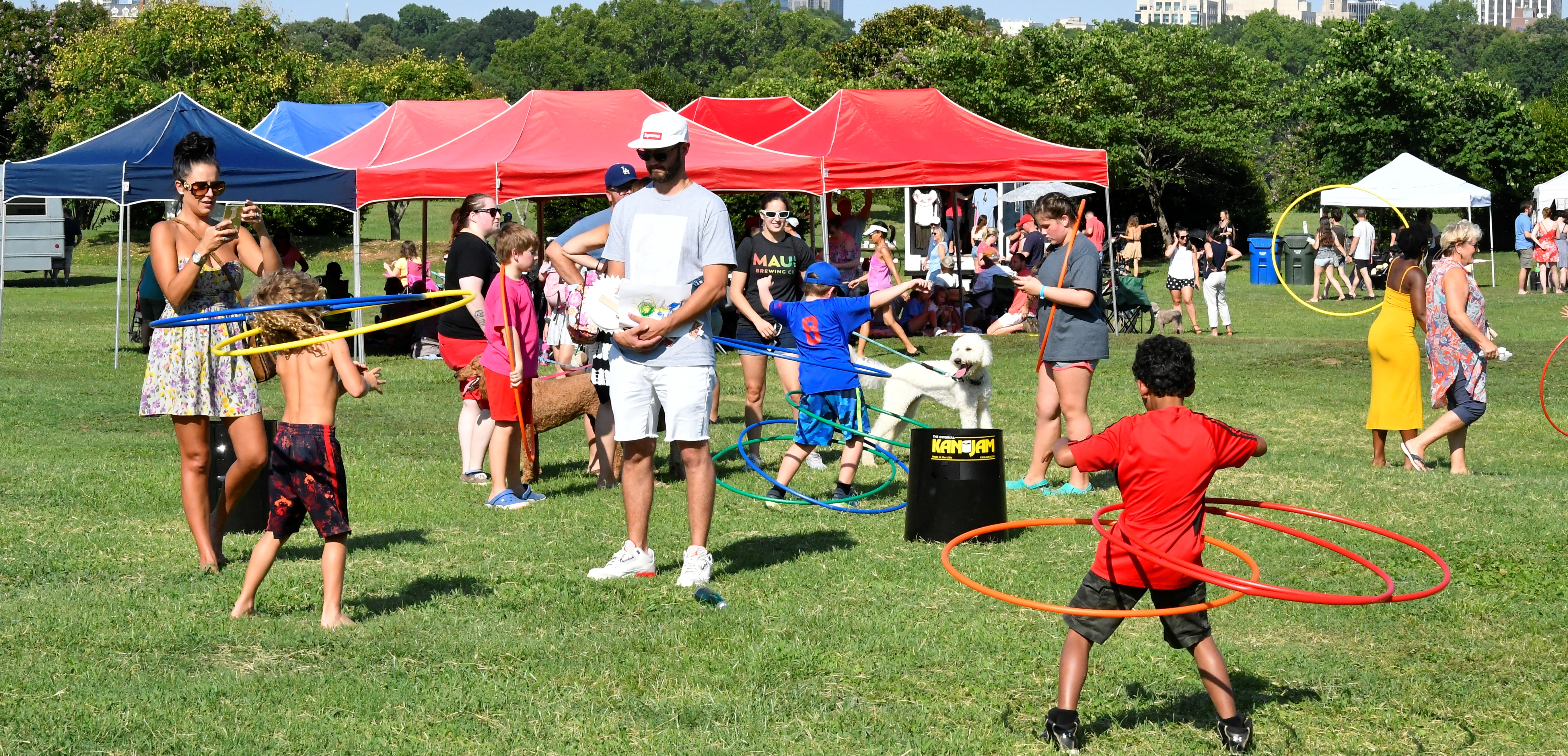 Families hula hooping at a Dix Park event