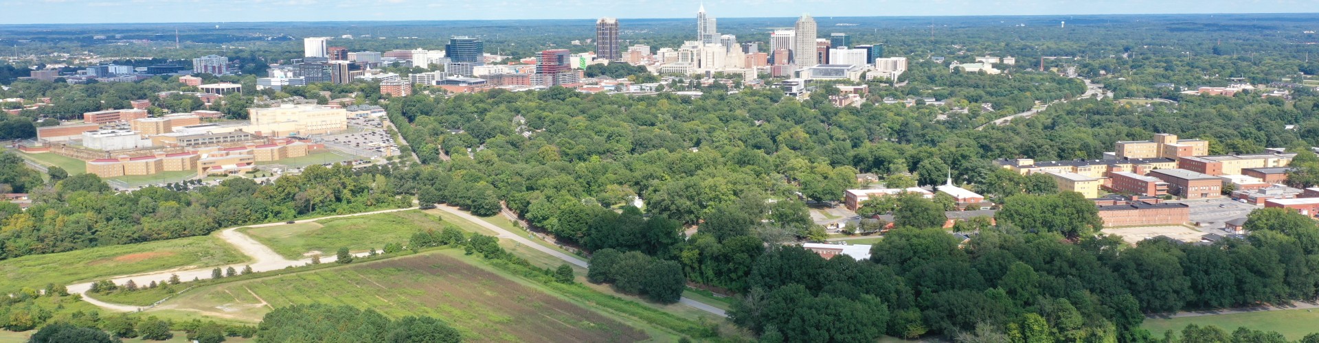 Drone shot of downtown Raleigh from Dix Park Big Feild