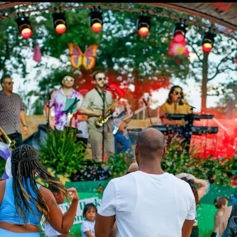 Gipson Play Plaza Opening Event People watching live music on stage