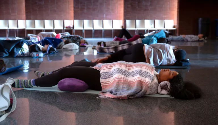 Sound Bath participant lying in the Dix Park Chapel
