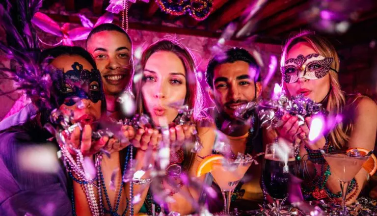 Mardi Gras masquerade party attendees  