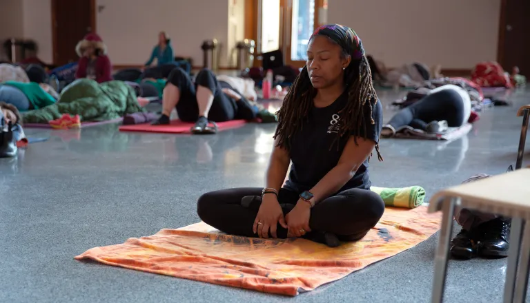 woman meditating on mat