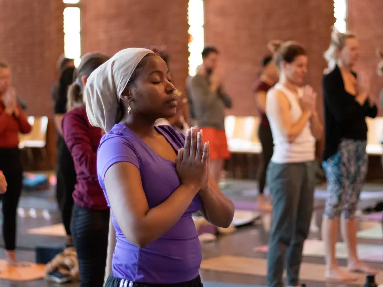 Adults in yoga poses