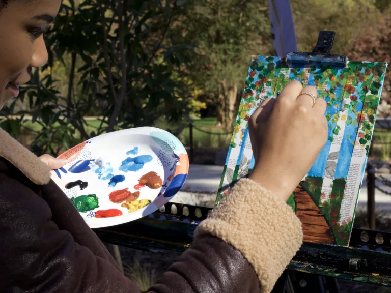 Painting outdoors during an art program at Dix Park