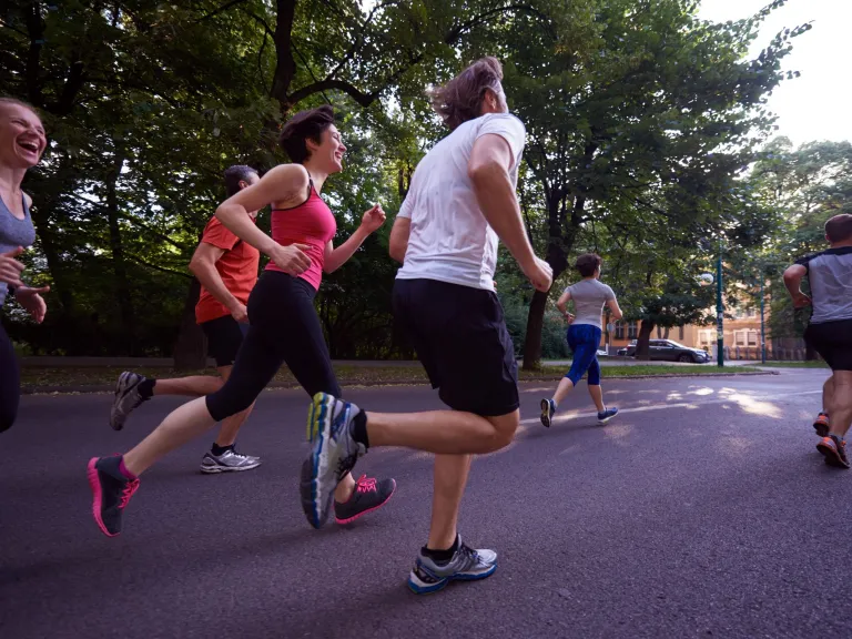 Group of people running in a park