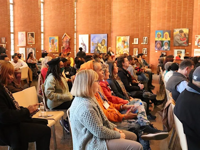 Audience at an artist talk in the Dix Park Chapel