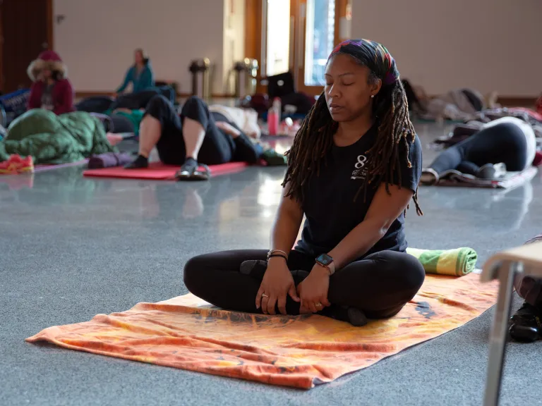 woman meditating on mat