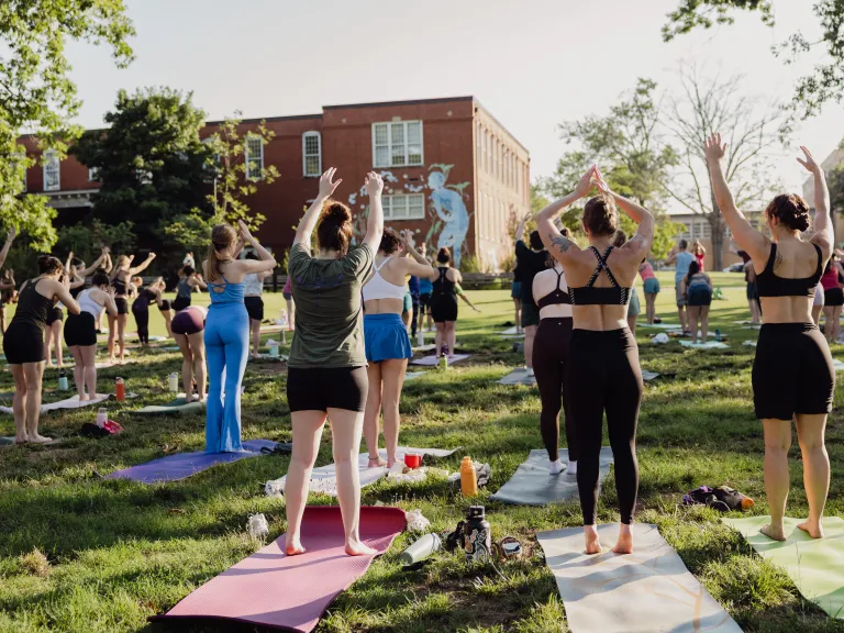 adults doing yoga