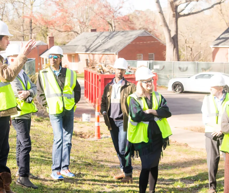 Adults in hard hats